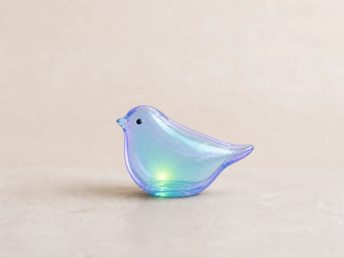 The ceramic bird transformed into luminous translucent glass.